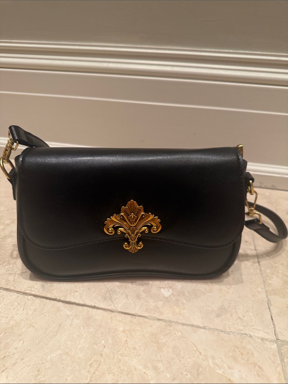 Black Leather Crossbody Bag with Gold Ornament